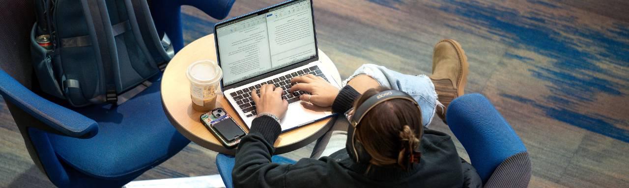 GVSU student studying on computer.